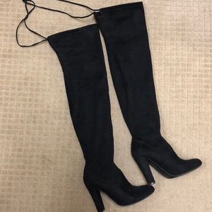 Black thigh-high Steve Madden boots